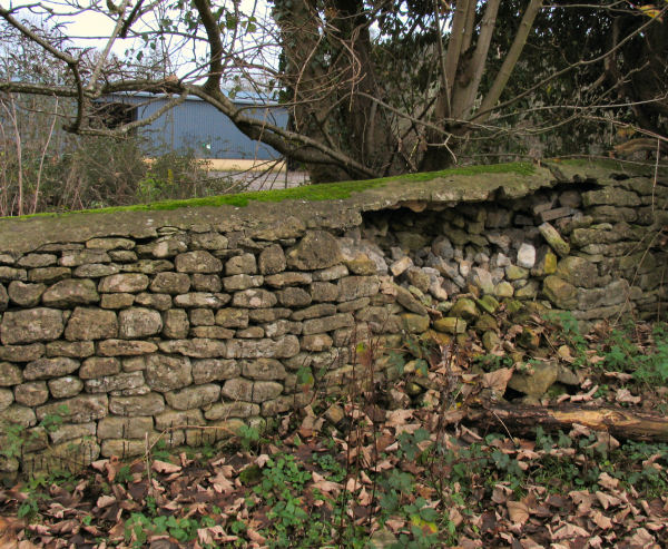 low stone wall at Freshford Mill no fencing to deter intruders