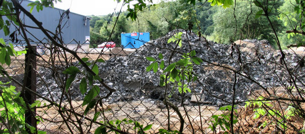 Huge pile of rubber and other contamination at Freshford Mill